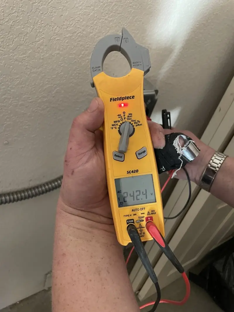 Voltage testing with clamp meter during Outlet Installation in Ebensburg